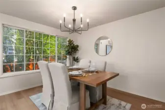 Dining room shares the living room space with more windows to bring in the natural light.