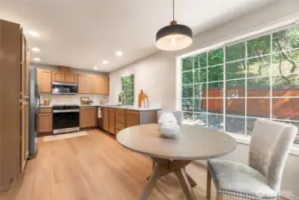 Open kitchen adjacent to the great room has new appliances, flooring, paint and more.