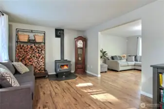 As you enter the home, on your left you will find your family room with wonderful wood stove to keep you warm on cooler nights.