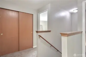 Upstairs landing view, HUGE linen closet, primary suite is straight ahead. Other bedrooms and full bath are on back and other side of the upper level.