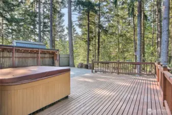 View of your hot tub from your side deck. Love all the tall trees.