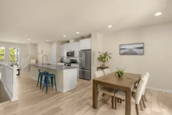 Dining room sits just off the kitchen, perfectly placed for easy meals and effortless entertaining, with seamless access to the patio for indoor-outdoor gatherings.