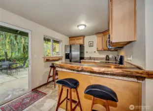 Sitting Bar Off The Kitchen Area With Lots Of Light.