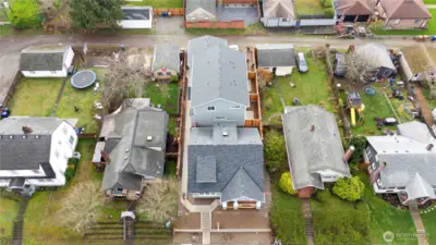 Plat includes 3 units - single family home & 2 townhomes with detached garage and parking spaces off the alley.