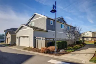 GPS will bring you to garage. Park in front of garage door and enter in front.