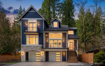 Set among the peaceful, wooded beauty of Lake Marcel, this 2024 custom-built home offers the kind of lifestyle that feels like a retreat from the moment you arrive.  A huge two-car garage provides ample room for vehicles, storage, and all the lake toys that come with this lifestyle.