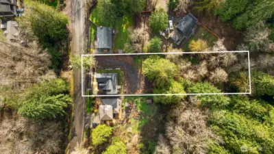 Tucked onto nearly a half-acre, the setting is remarkably private and serene, surrounded by nature and designed for those who crave both beauty and breathing room.