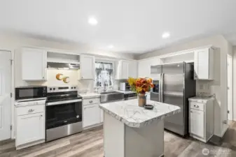 Kitchen island, stainless steel appliances, farm sink