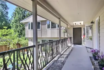 A covered walkway overlooking the front patio welcomes you to entry. Notice level entry.