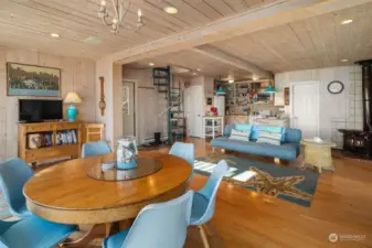 Looking back to the living and kitchen areas. Stair to the upper level is a spiral.