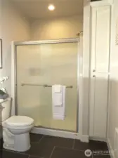 PRIME BATH ALSO HAS AN OVER-SIZED STEP-IN SHOWER AND STORAGE CABINET!