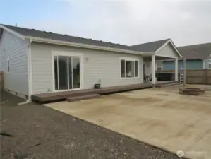 VIEW OF THE BACK OF THE HOME PATIO AND EASY CARE YARD!