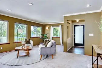 Foyer to living room which has walls of windows to maximize the glorious view.