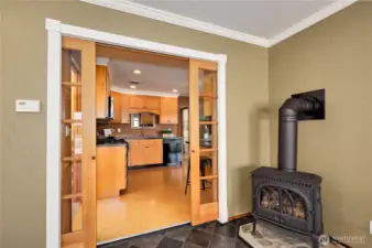 Natural gas stove, pocket doors to the kitchen.
