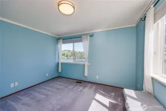 Bedroom 1 of 3 upstairs, 4 total. Great views and a built-in window seat.