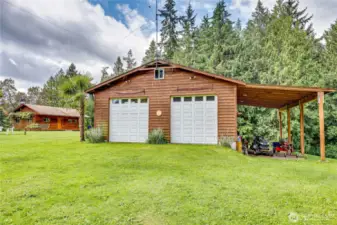 Shop with carport.  The shop is fully insulated and has a wood stove for heat.