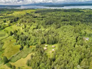 Four buildings in a compound like setting, with privacy, quiet and all the trails you could ever imagine.  Walkers, hikers, mountain bikers, dirt bikes and ATV's riders will all enjoy this one-of-a-kind Kitsap Peninsula setting.