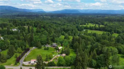 This shy 10 acre property has it all, views, barn, shop, sport court and subdividable.