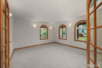 Main level bedroom that has been recently used as an office.