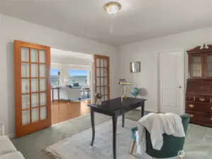 This room lives like a 2nd primary bedroom, with a walk-in closet through that door, that then leads to the bathroom.