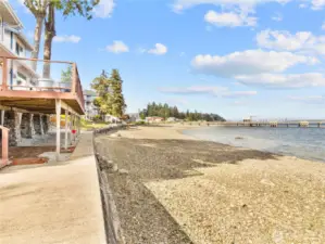 Plenty of waterfront entertaining areas. Large deck above and even more space below with the covered patio and large concrete side area.