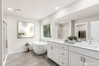 Primary ensuite features double sinks, soaking tub and luxious shower.Photo's are for representational purposes only. Colors and finishes may differ.
