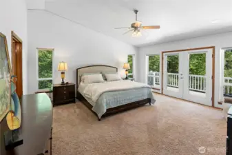 Primary bedroom from entry.  Double door deck access.