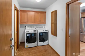 Mud and laundry room off Garage access, Primary Bath, and Kitchen.