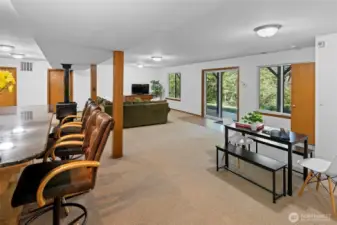 Doors at the far end are utilities and storage area, and lower level heated garage / shop.