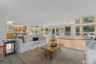 A long hallway leads you from the entryway into this grand living/dining area.