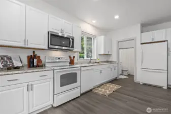 New cabinets, counters, trim, flooring, paint and updated bathroom!