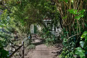 Secret garden can be embraced and tamed, or with no "significant tree" removal limitations (per provided arborist report, buyer to verify), you can work with the City to re-imagine how the greenery sits on this property.