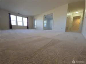 Hallway on right leads to the Primary bedroom.  Turn R before that door to exit the unit