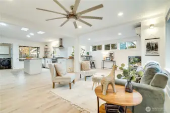 Step inside to a bright, open floor plan featuring low-maintenance luxury vinyl flooring, recessed lighting, skylights, and abundant windows for beautiful natural light throughout.