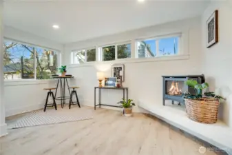 The gas fireplace adds cozy comfort on rainy winter days, while the flexible bonus space works beautifully as a dining area, home office, reading nook, or a perfect spot for morning coffee.