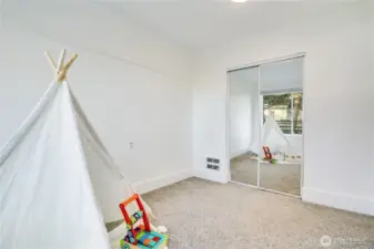 A well-placed closet offers practical storage for this versatile space.