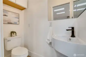 A wall-mounted storage cabinet keeps everything neatly organized.