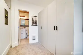 Recently added armoires complement the primary closet to provide ample wardrobe storage.