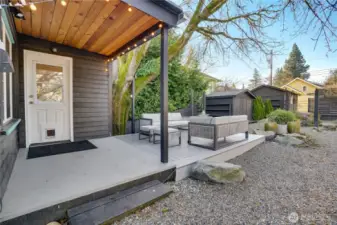 Just outside the back door, a covered porch offers a perfect spot for a barbecue or smoker. Enjoy year-round outdoor cooking!