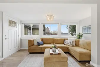 The light filled living room is cozy and roomy at the same time.