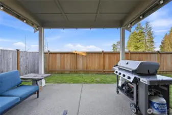 Nice covered sitting and BBQ area in your private fully fenced backyard