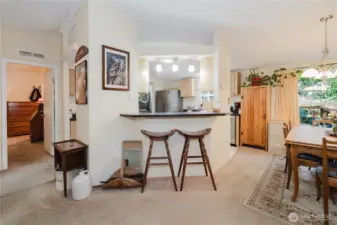 Photo taken from the dining room to the breakfast bar looking into the kitchen.