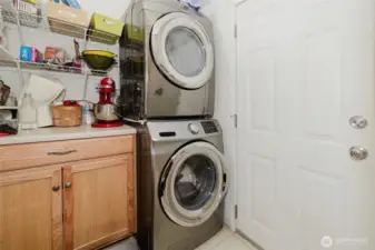 Washer Dryer and sink in mudroom leading to your Beautiful oasis, back deck and Party Barge.