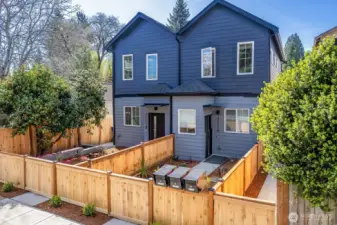 Fully fenced front and back yard with easy, well lit access.