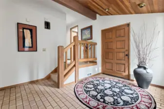 Front entry showing stairs to upper bedrooms/flex room.