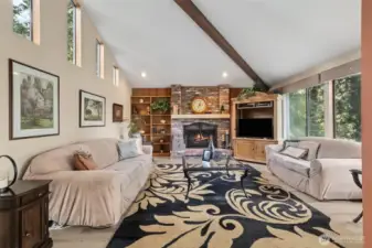 Beamed ceiling and fireplace give this room invites you and your guests.