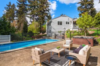 Sunbathed yet private backyard offers an in-ground pool with plenty of entertaining space!