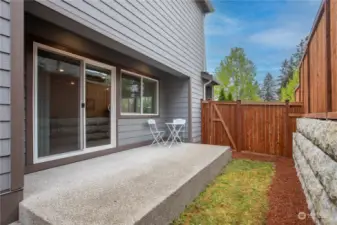 Semi-covered Patio and gate access to the front yard.