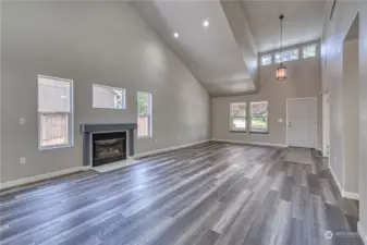 Vaulted ceilings and neutral colors greet you at the entry