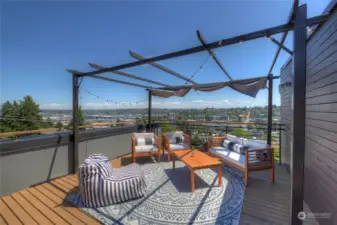 The stunning views from the roof deck include a place to site and relax, as well as dine and BBQ.
